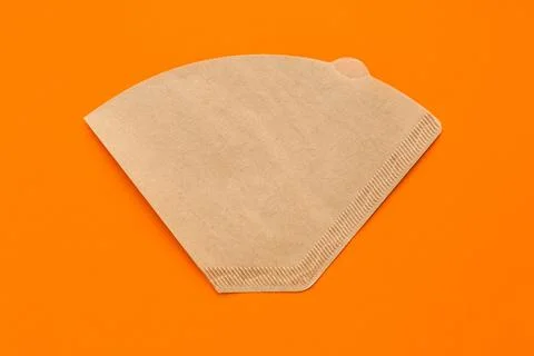 Eco coffee filter isolated on minimal orange background. Pour over method Photos