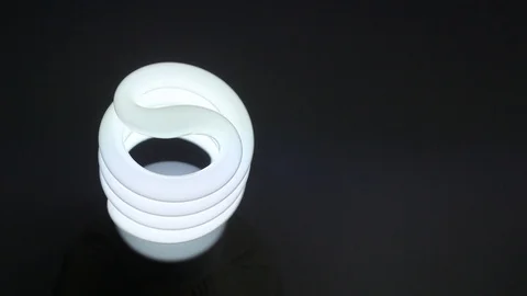 Eco energy saving spiral light bulb  Stock Footage