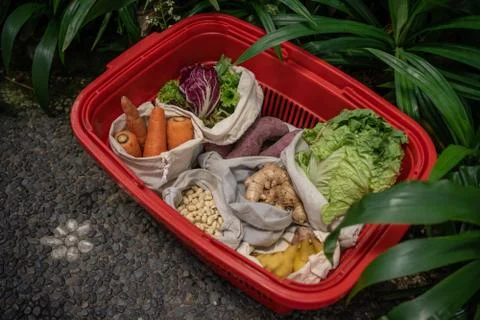 Eco friendly and reusable zero waste cotton bags in basket Stock Photos