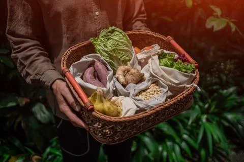 Eco friendly and reusable zero waste cotton bags in basket Stock Photos