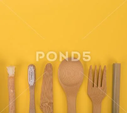 Eco friendly bamboo cutlery and teeth brushes. Zero waste concept. Stock Photos