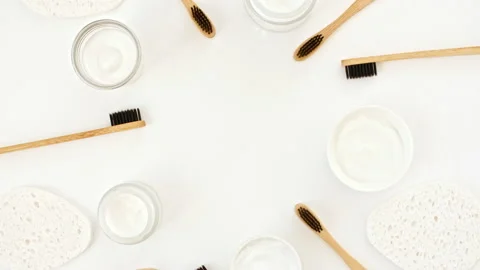 Eco-friendly biodegradable Bamboo toothbrush, White cosmetic bottle containers Stock Footage 238664982