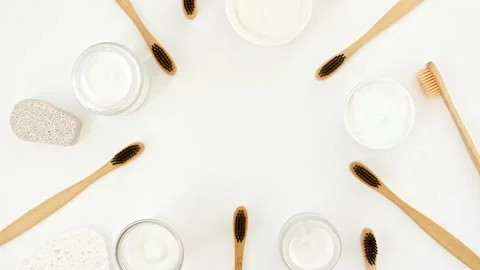 Eco-friendly biodegradable Bamboo toothbrush, White cosmetic bottle containers Stock Footage 239015811