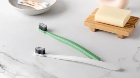 Eco friendly brushes on the marble table. Oral hygiene. Stock Photos