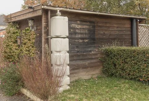 Eco-friendly device for catching and storing rain water Stock Photos
