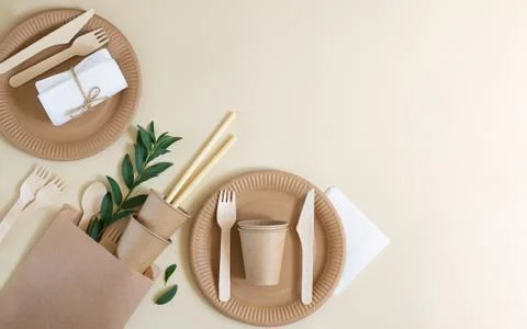 Eco friendly disposable tableware made paper on beige background. Zero waste Stock Photos