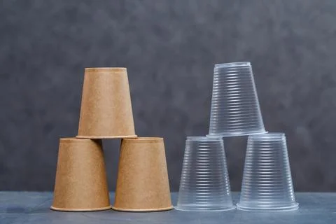 Eco-friendly disposable tableware made of bamboo wood and paper on a gray bac Stock Photos