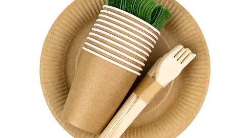 Eco-friendly disposable tableware set with kraft paper cups, plates, a Stock Footage 347736646