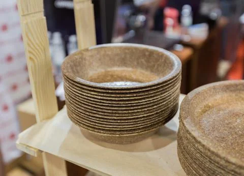 Eco-friendly disposable tableware, set of thick plates made from recycled pla Stock Photos