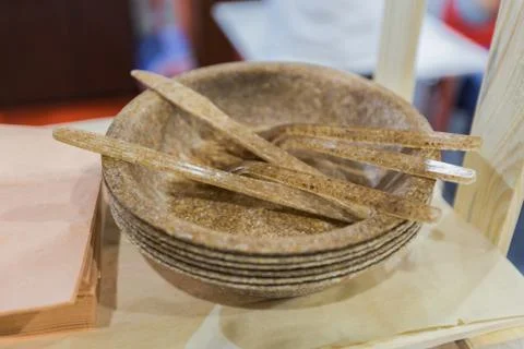 Eco-friendly disposable tableware, set of thick plates made from recycled pla Stock Photos