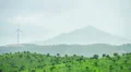 Eco-friendly energy generation sources. Wind turbine against mountain silhouette HD Footage