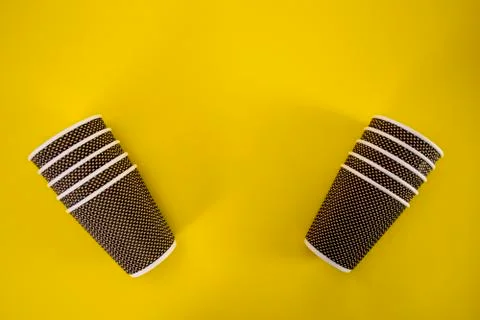 Eco-friendly glasses for drinking tea and coffee on a yellow background zero  Stock Photos