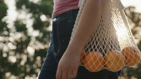 Eco friendly go green net zero using mesh tote bag. Save the earth. Stock Footage 231541593