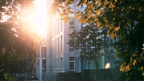 Eco-Friendly Modern Office: 5-Story Building with Metal Cladding Amidst Greenery Stock Footage 280508155