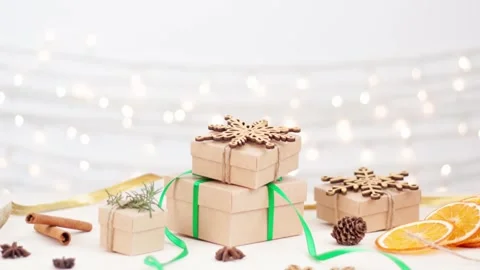 Eco friendly packaging gifts in craft paper on wooden table Stock-Footage 306482323