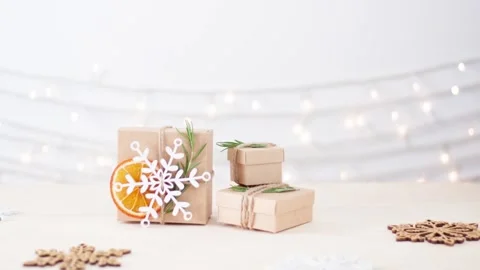 Eco friendly packaging gifts in craft paper on wooden table Stock-Footage 306482429