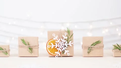 Eco friendly packaging gifts in craft paper on wooden table Stock-Footage 306482448