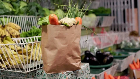 Eco-Friendly Paper Bag of Fresh Vegetables at Local Sustainable Produce Market Video stock 345837741