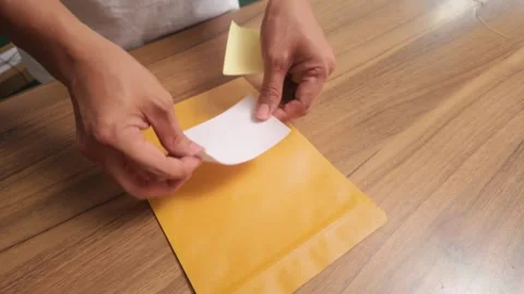 Eco Friendly Parcel Packing Hands Using Recycled Paper for Shipping 動画素材 327902286