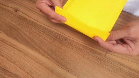 Eco Friendly Parcel Packing Hands Using Recycled Paper for Shipping Stockbeeldmateriaal 327902297