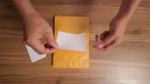 Eco Friendly Parcel Packing Hands Using Recycled Paper for Shipping 動画素材 327902300