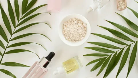 Eco friendly products on white background with green palm leaves. glass bottle Stock Footage 216023075