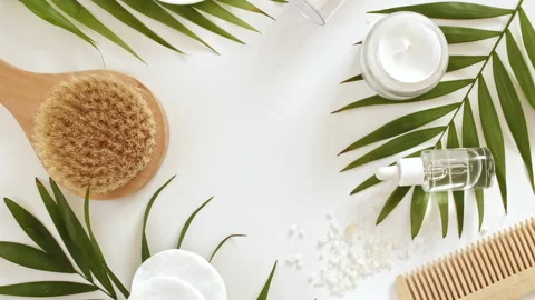 Eco friendly products on white background with green palm leaves. Gel, fluid Stock Footage 216036232