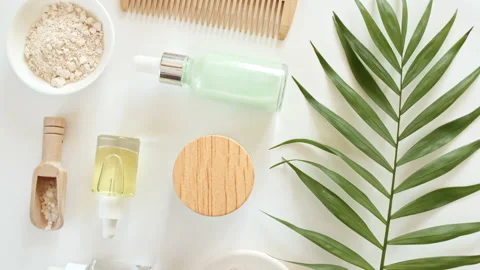 Eco friendly products on white background with green palm leaves. Bottle with 库存影片 220940774