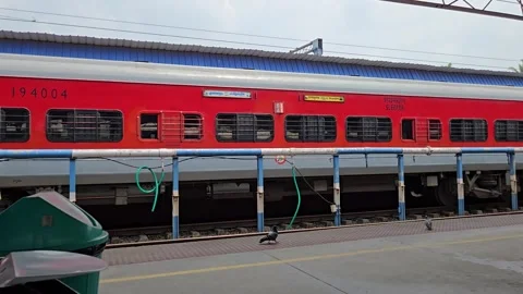 Eco-friendly station transit highlighted by foraging birds and a public waste bi Stockbeeldmateriaal 340991168