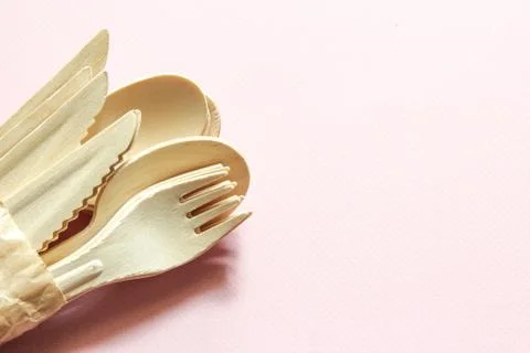 Eco-friendly tableware. Spoons, forks, knives made of wood. Stock Photos