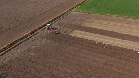 Eco Friendly Tractor Preparing Fields for Sustainable Crops Видео 332815501