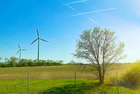 Eco friendly Wind turbines device that converts the kinetic energy of wind in Stock Photos