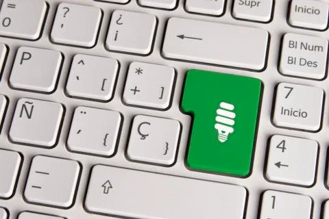 Eco green concept, light saving bulb keyboard key. Stock Photos