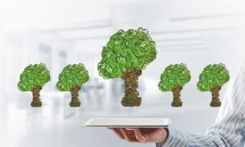 Eco green environment concept presented by tree as working mechanism or engine 写真素材