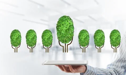 Eco green environment concept presented by tree as working mechanism or engine 写真素材