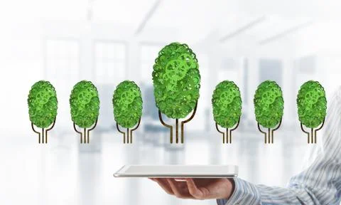 Eco green environment concept presented by tree as working mechanism or engine 스톡 사진