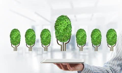 Eco green environment concept presented by tree as working mechanism or engine 스톡 사진