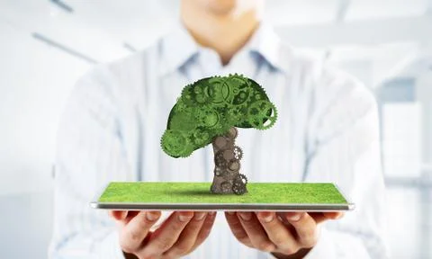 Eco green environment concept presented by tree as working mechanism or engine Foto stock