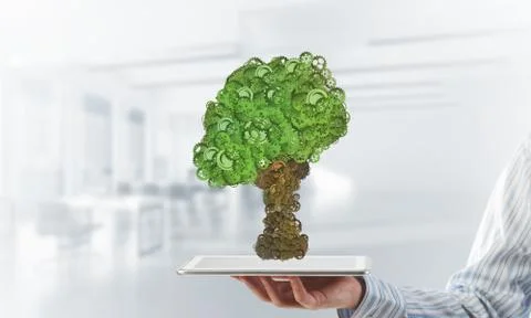 Eco green environment concept presented by tree as working mechanism or engine Foto stock