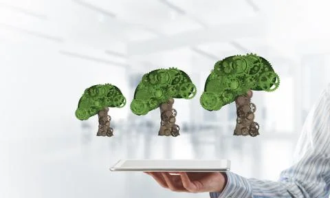 Eco green environment concept presented by tree as working mechanism or engine 스톡 사진