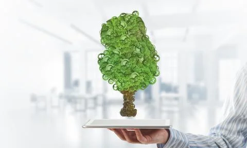 Eco green environment concept presented by tree as working mechanism or engine Foto stock