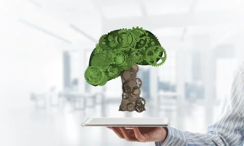 Eco green environment concept presented by tree as working mechanism or engine 스톡 사진