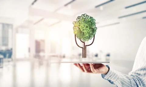 Eco green environment concept presented by tree as working mechanism or engine Stock Photos