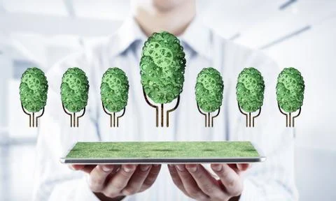 Eco green environment concept presented by tree as working mechanism or engine 스톡 사진