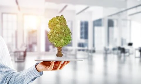 Eco green environment concept presented by tree as working mechanism or engine 写真素材