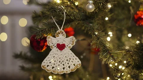 Eco knitted decoration in form of white angel holding on Christmas tree. Stock Footage 251210002