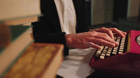 Eco machine of typewriter in a library guy type some text details Video stock 134061516
