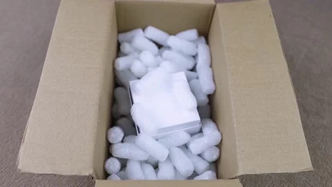 Eco package of parcels and biodegradable filler. Box is filled with a filler tha 動画素材 233066040