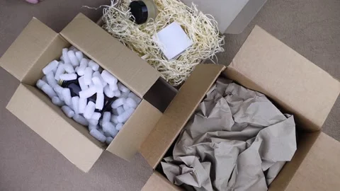 Eco package of parcels and biodegradable filler. Box is filled with a filler tha Stock Footage 233066201