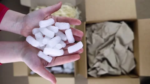 Eco package of parcels and biodegradable filler. Box is filled with a filler tha Stock Footage 233066225